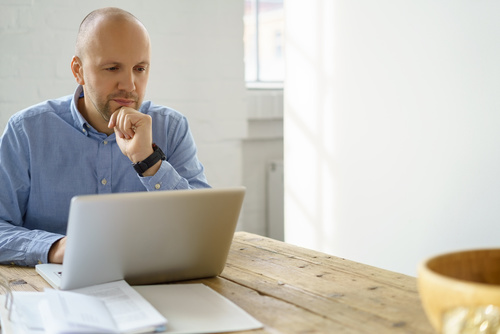 man doing work on laptop