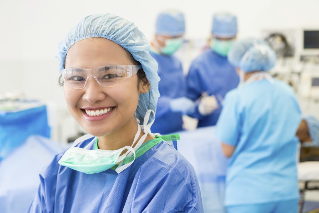 young female doctor in scrubs iStock 000074122127 loans for doctors