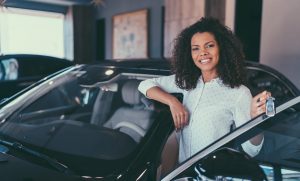 young woman buying new car iStock 1039931504 medical student insurance