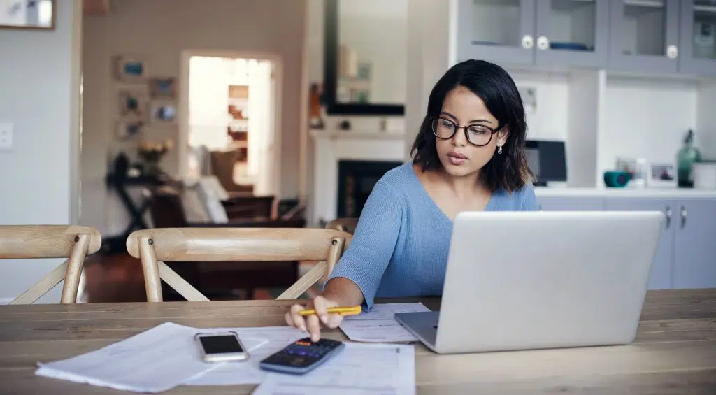 Tax and Accounting for Private Practice 9 tax accounting for doctors; accountants for medical practitioners; accountants for doctors; lady sitting at table with computer and calculator doing taxes