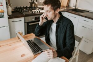 Senior registrar on the phone working on fellowship plan