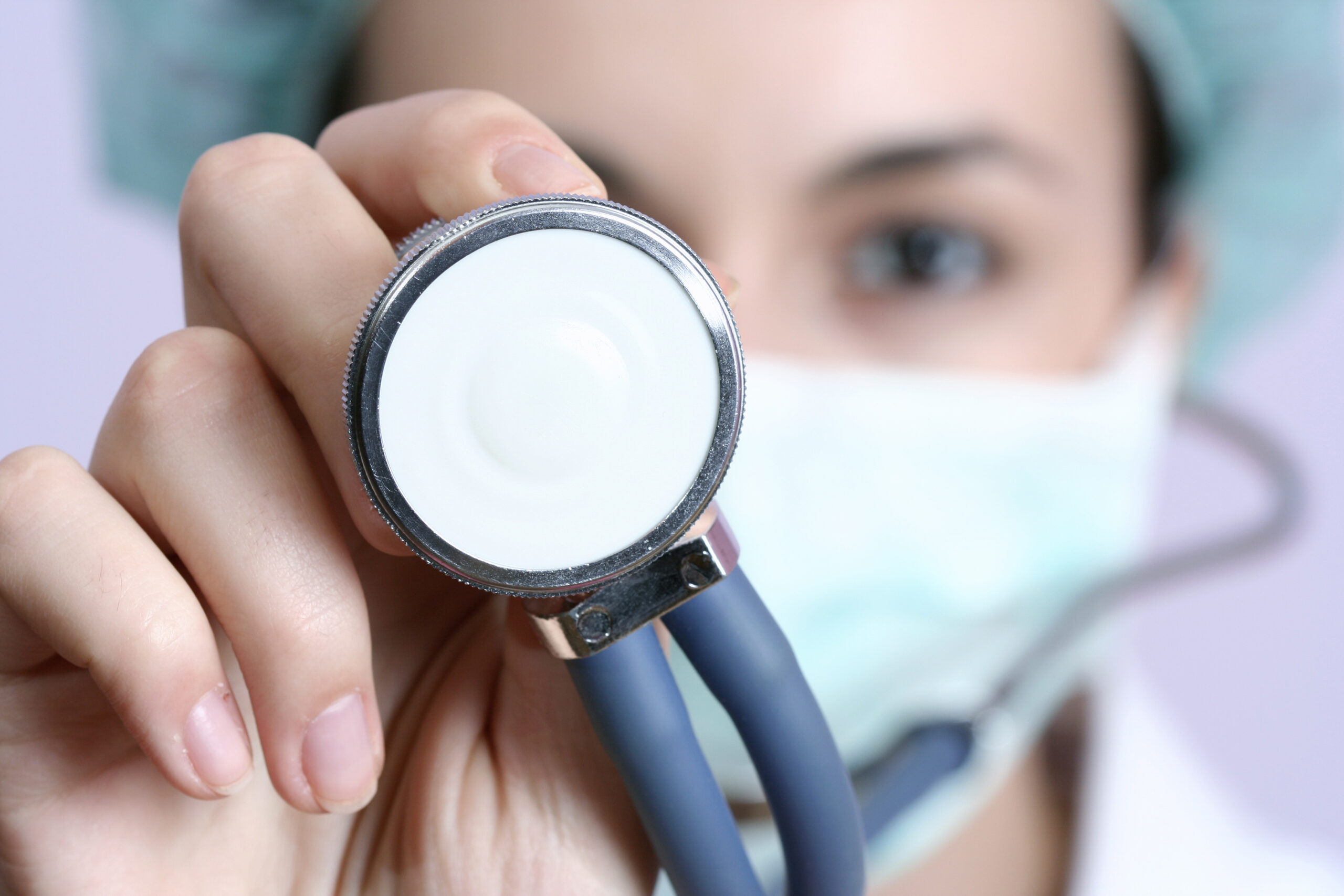 Doctor performing health check with stethoscope