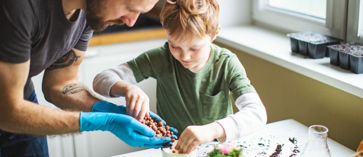 Father-and-son-spending-time-together-with-plants-iStock-1137930766