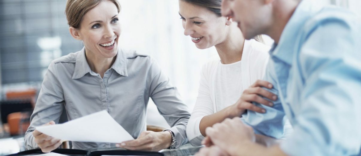 female-explaining-paperwork-iStock_000053155048