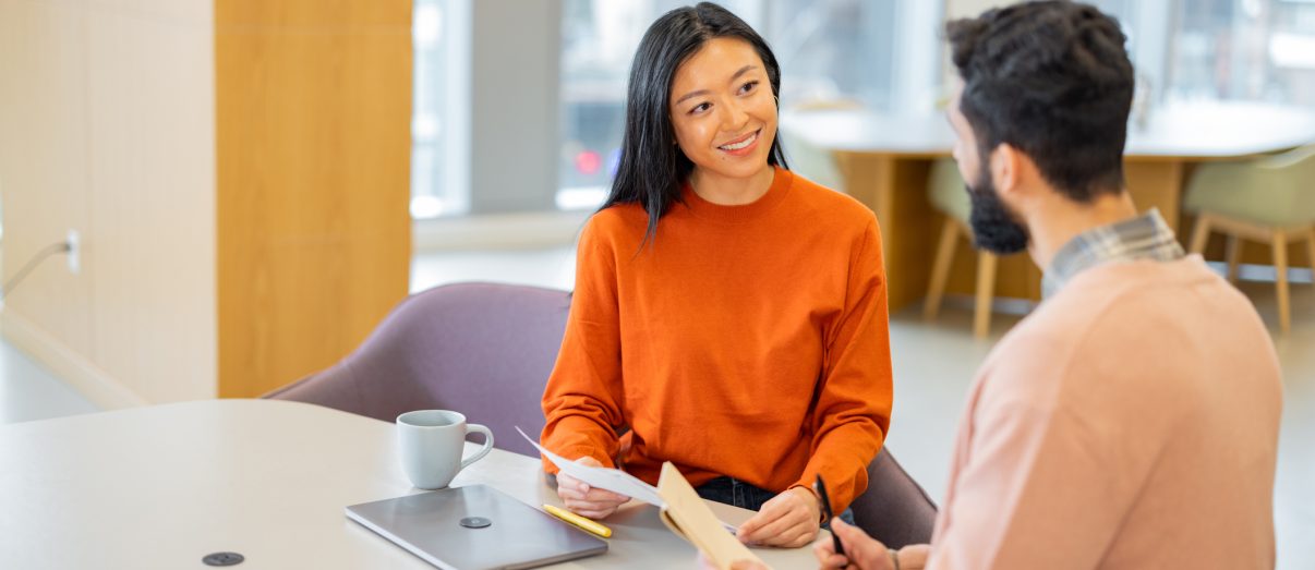 Man consulting with female real estate agent - stock photo