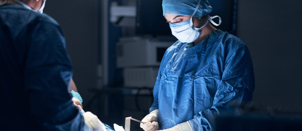 Shot of surgeons performing surgery in an operating theatre