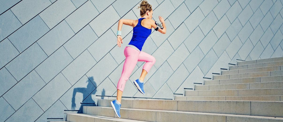 woman-running-up-stairs-in-activewear-iStock-825721894