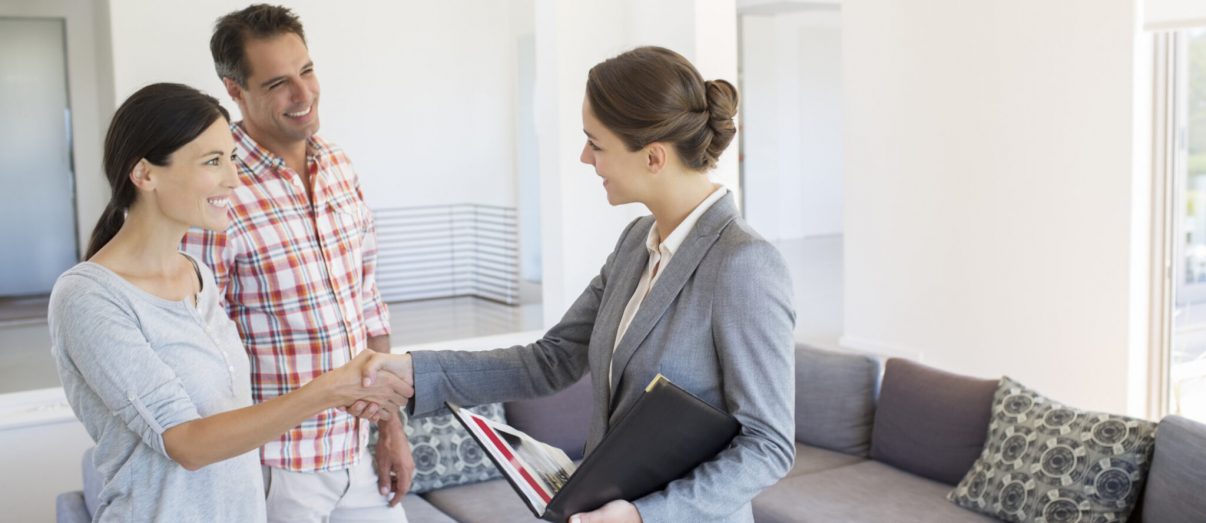 young-couple-buying-house-GettyImages-184313156