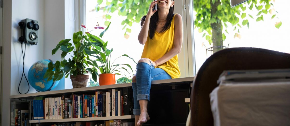 young-woman-on-phone-in-spring-iStock-1000846194